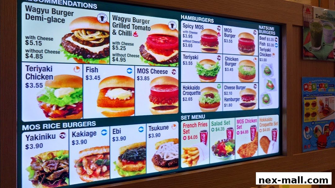 A digital menu board displaying various burgers, rice burgers, and set meals from MOS Burger.