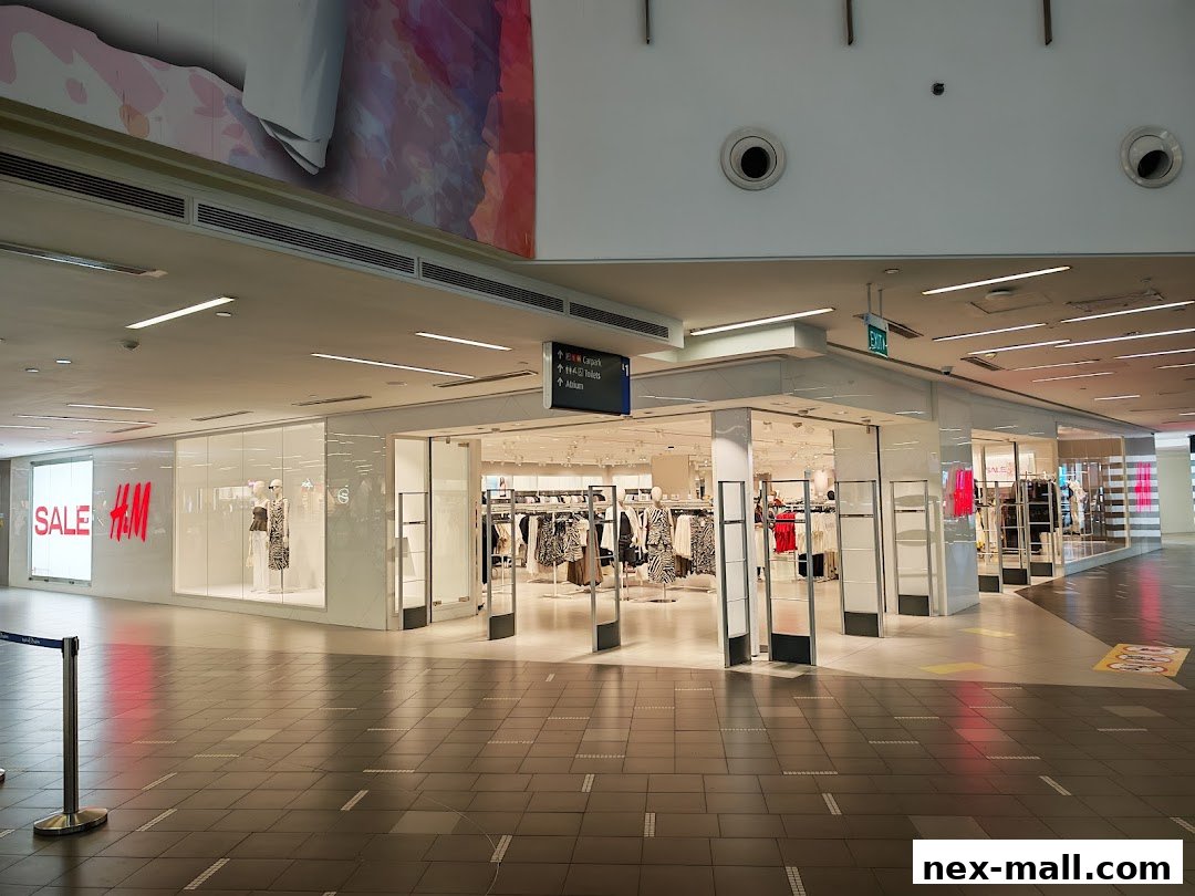 The H&M store entrance with mannequins and clothing displays visible inside.