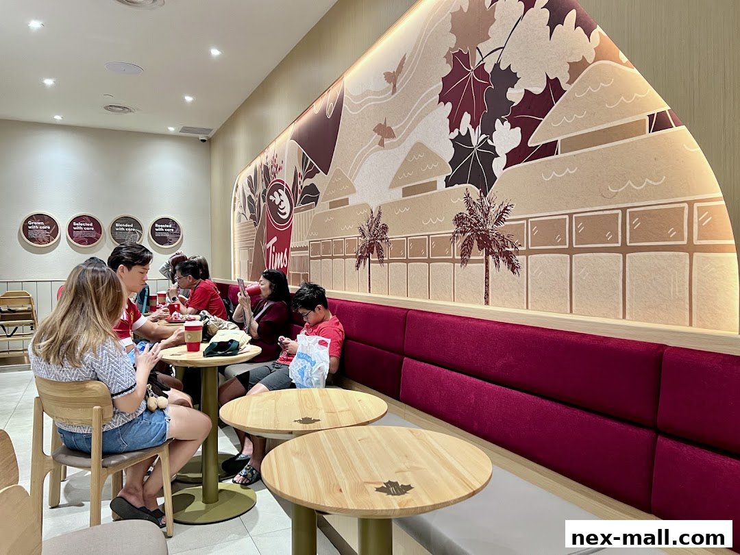 People dining at Tim Hortons with a large mural on the wall.