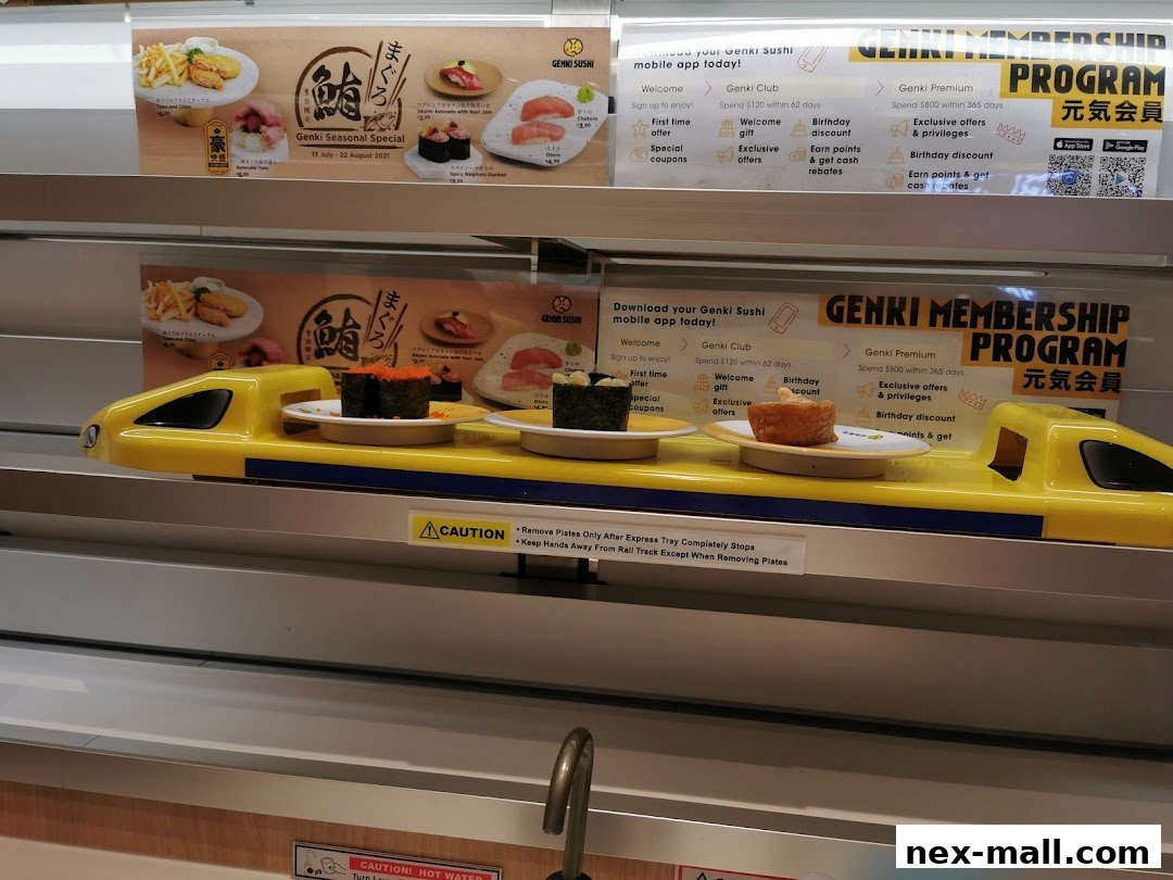 Sushi served on a conveyor belt train at Genki Sushi NEX.