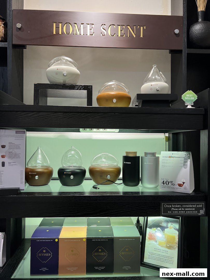 A display of HYSSES home scent diffusers and beeswax candles on shelves.