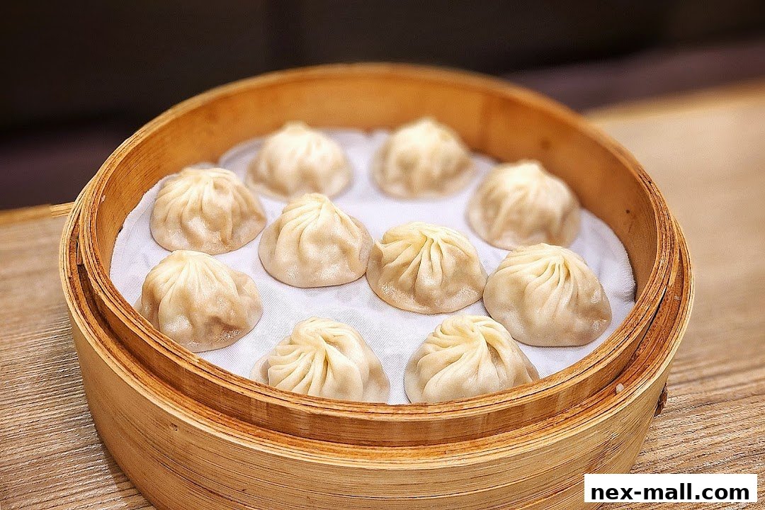 A bamboo steamer filled with delicious soup dumplings, a signature dish.