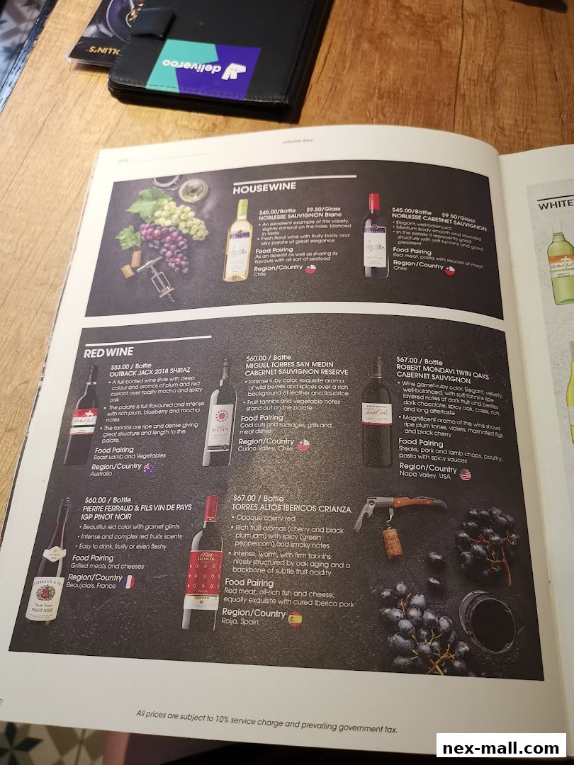 A menu page showcasing various red and white wines with descriptions and prices.