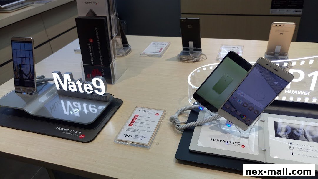 Huawei Mate 9 and P10 smartphones displayed with promotional signage and pricing.
