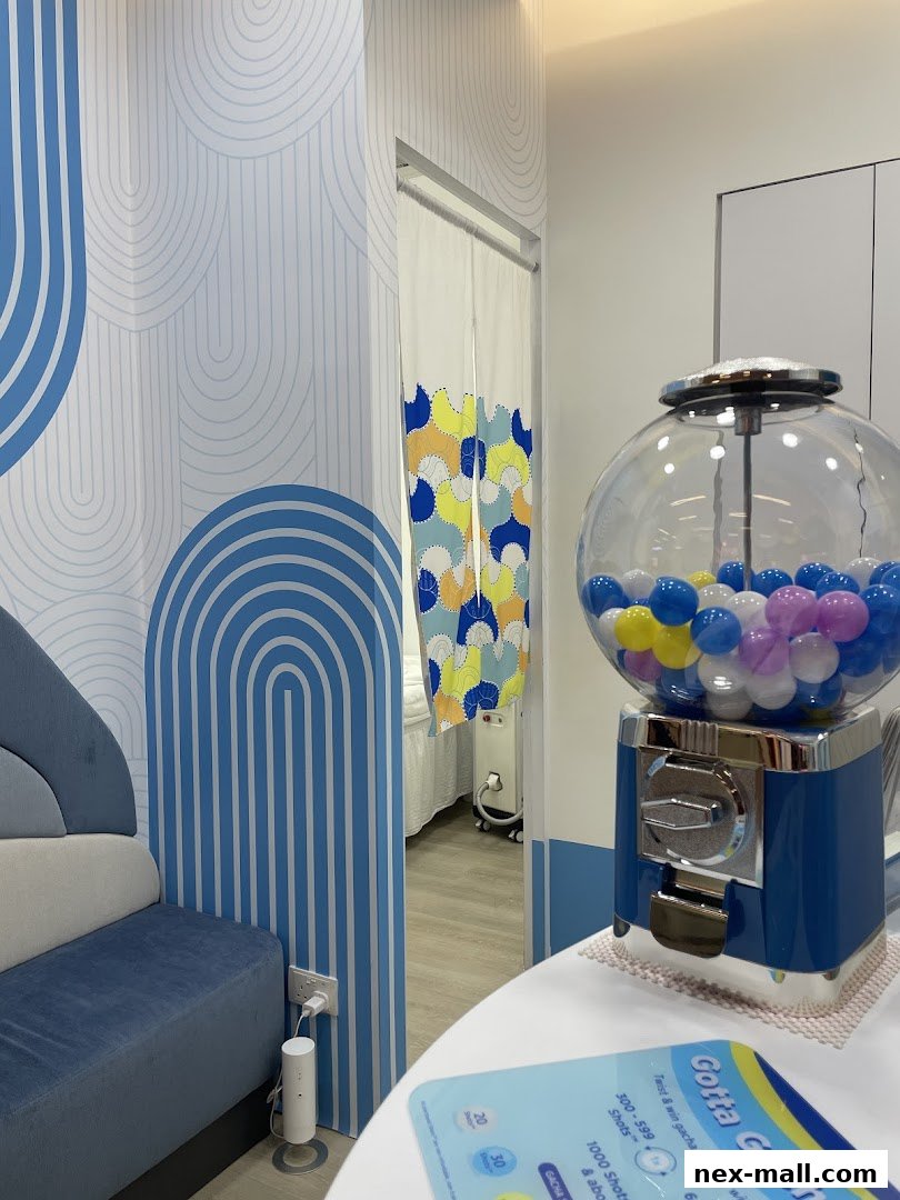 Interior of a modern beauty salon with a gacha machine and stylish decor.