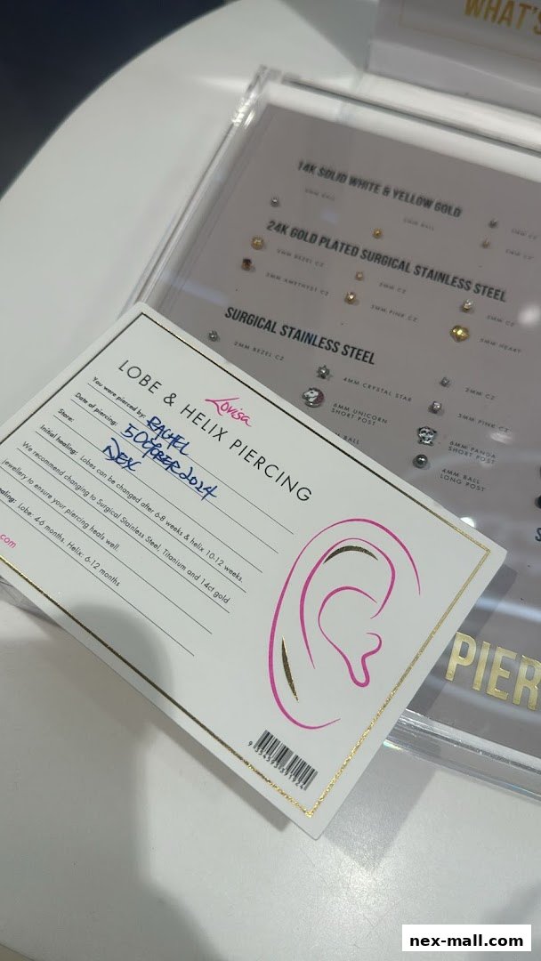 A piercing aftercare card and display of earrings at Lovisa.