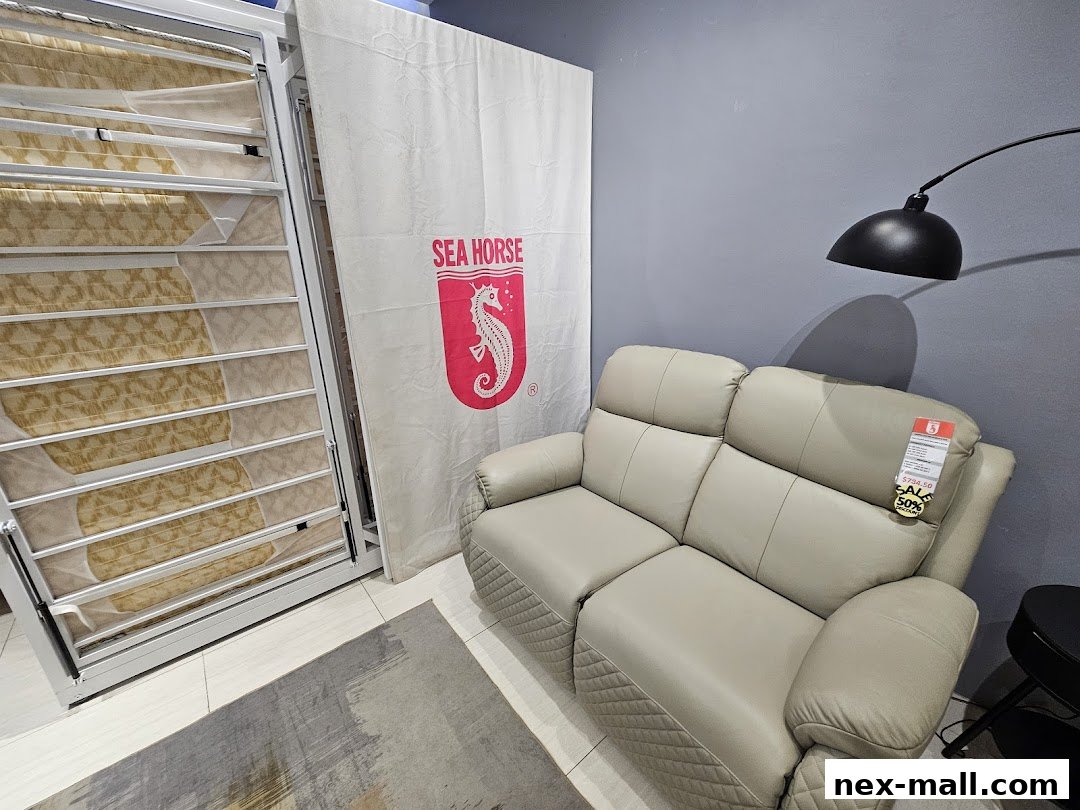 A light-colored sofa and mattresses are displayed in a store with a Sea Horse logo.
