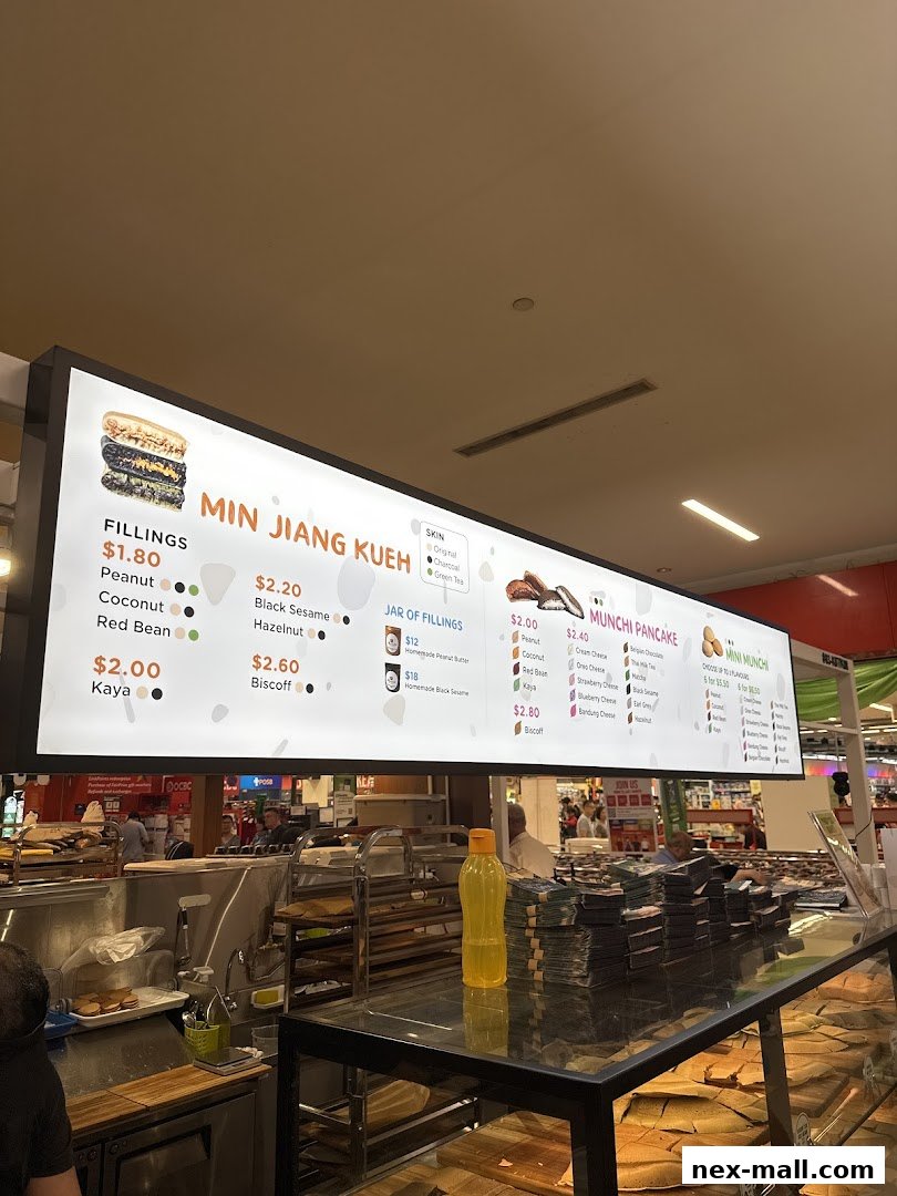 A brightly lit menu board displaying various pancake fillings and flavors at Munchi Pancakes.