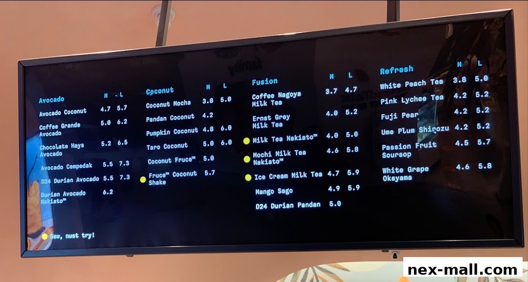 A digital menu board displaying various drinks with prices for different sizes.