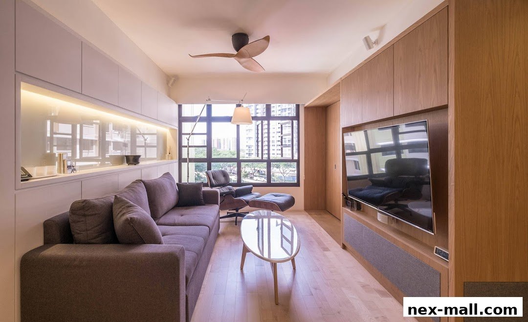 A modern living room with a sectional sofa, armchair, coffee table, and built-in entertainment unit.