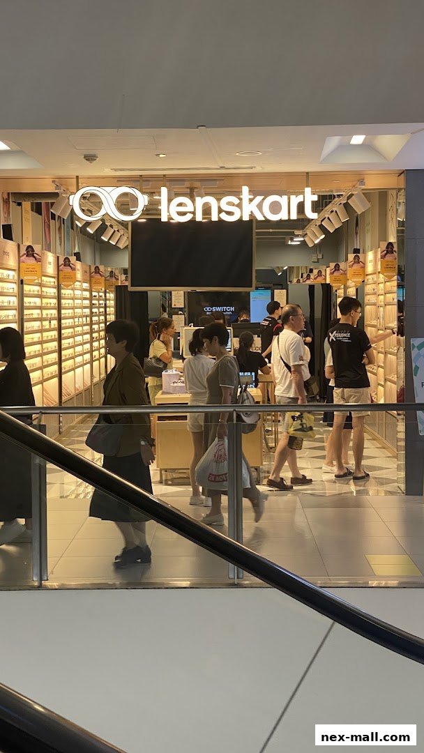 Lenskart NEX store entrance with customers browsing eyewear displays.