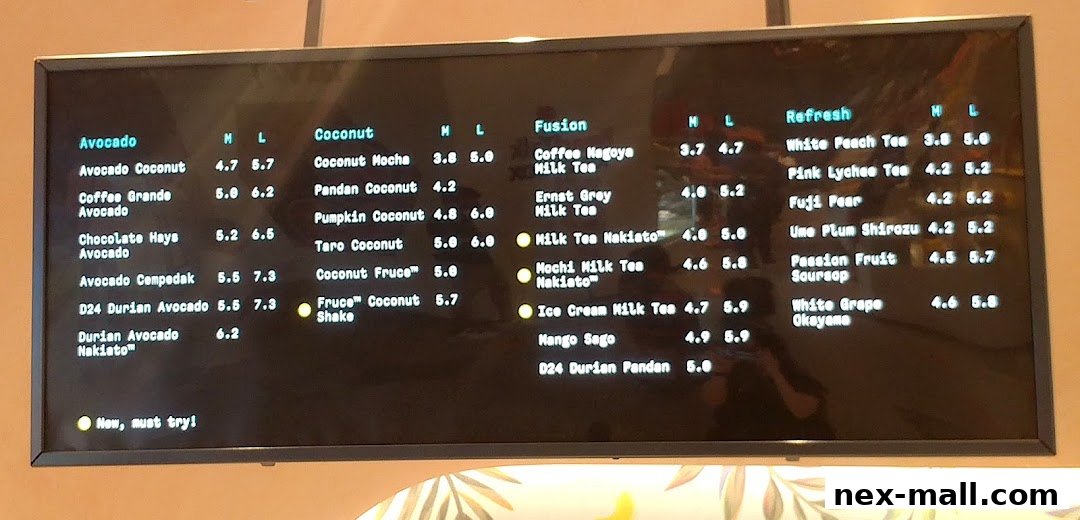 A digital menu board displaying various drinks with prices in different sizes.