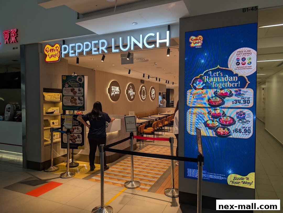 Pepper Lunch restaurant entrance with a digital display advertising Ramadan combos.