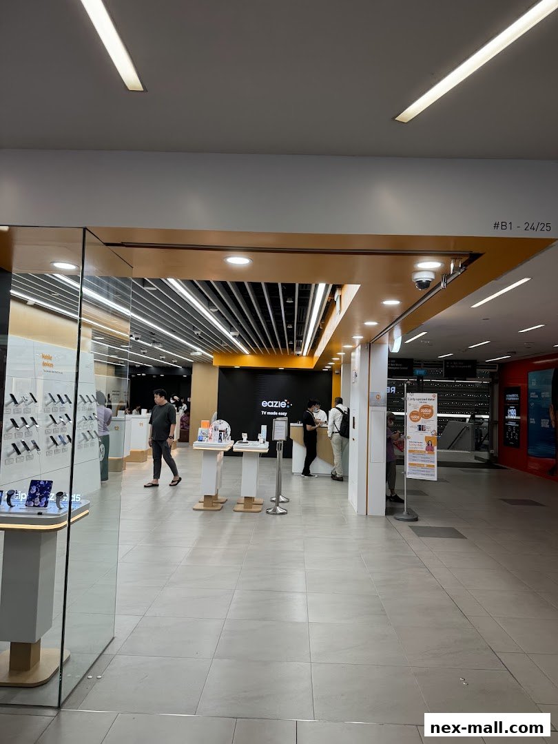 The entrance to a modern phone shop with displays of phones and service counters.