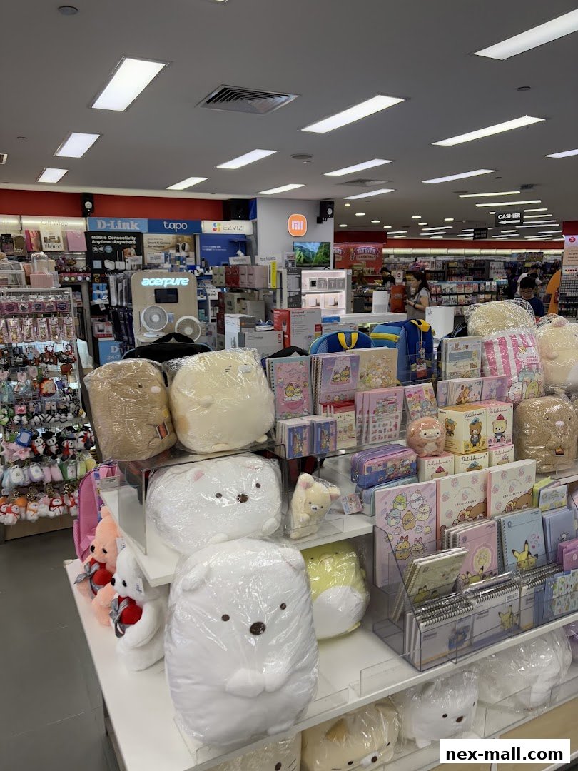A display of cute plush toys and stationery items inside a POPULAR Bookstore.