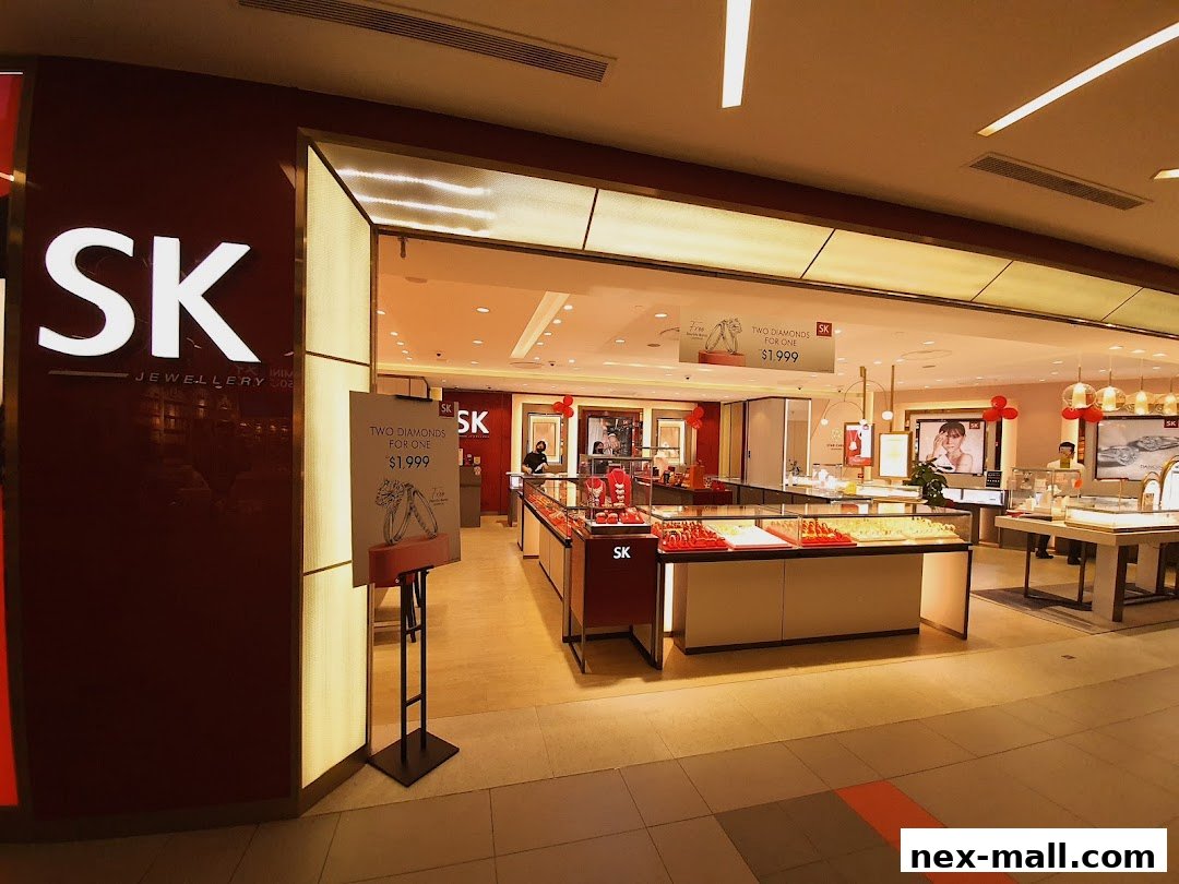 The exterior of the SK Jewellery store, showcasing display cases filled with jewelry and promotional signage.