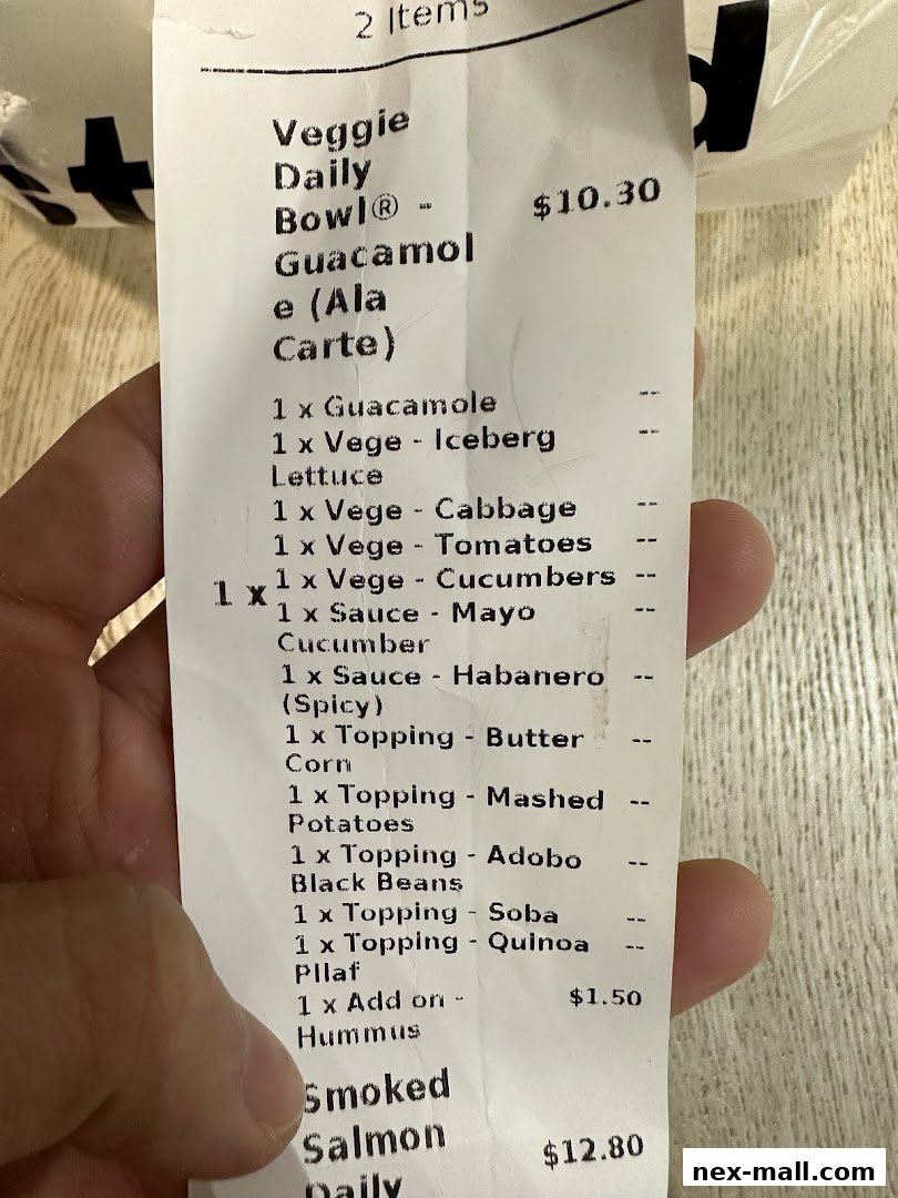 A receipt showing a Veggie Daily Bowl and Smoked Salmon Daily.