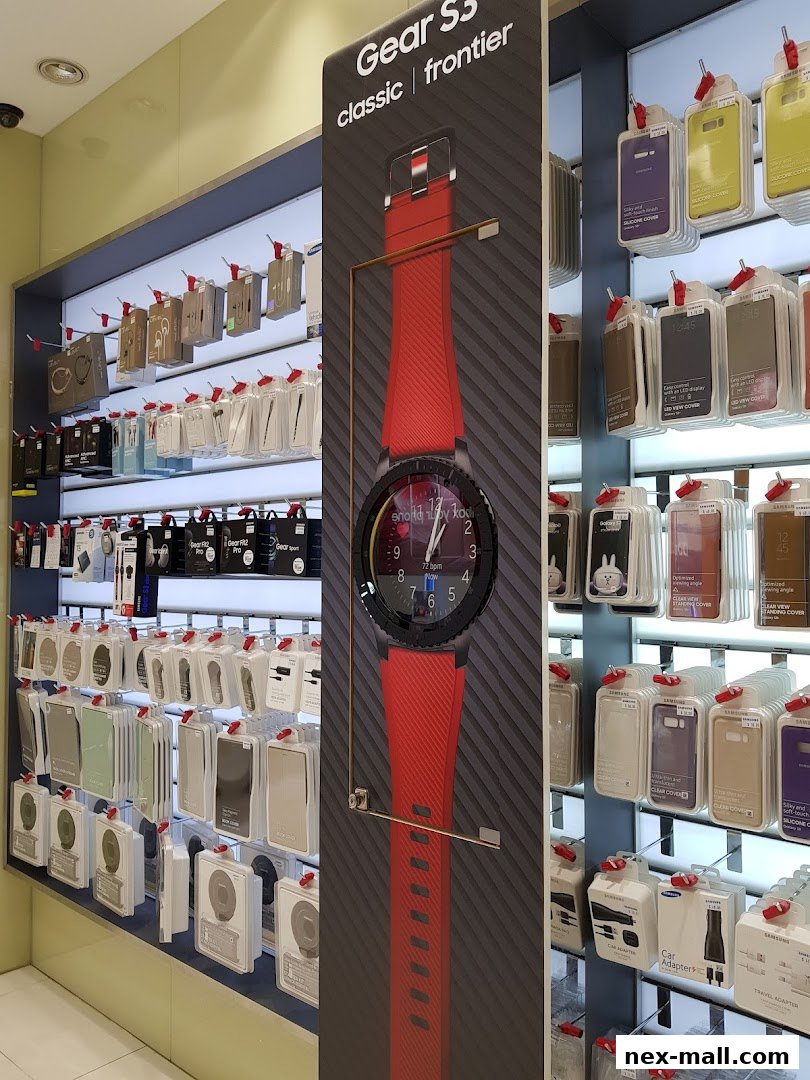 Samsung Experience Store interior showcasing a large display of Samsung Gear S3 smartwatch and various phone accessories.