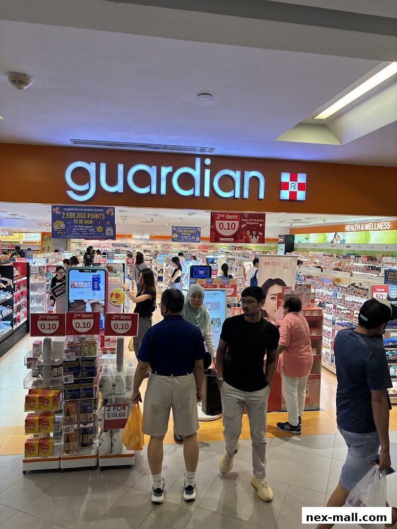 People shopping inside a Guardian Health & Beauty store with prominent signage.