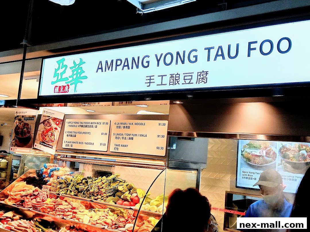 A food stall display with a menu and fresh ingredients for Yong Tau Foo.