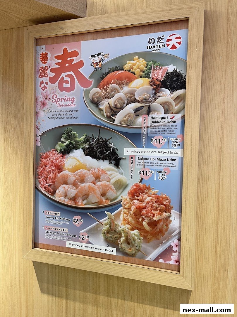 A menu board showcasing Idaten Udon's spring specials with colorful udon dishes.