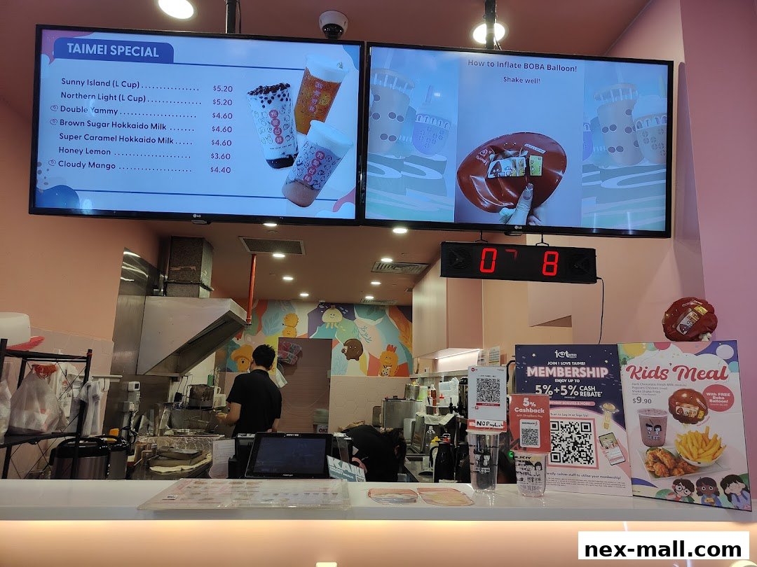 A menu board displaying special drinks and a kids meal offer at I Love Taimei.