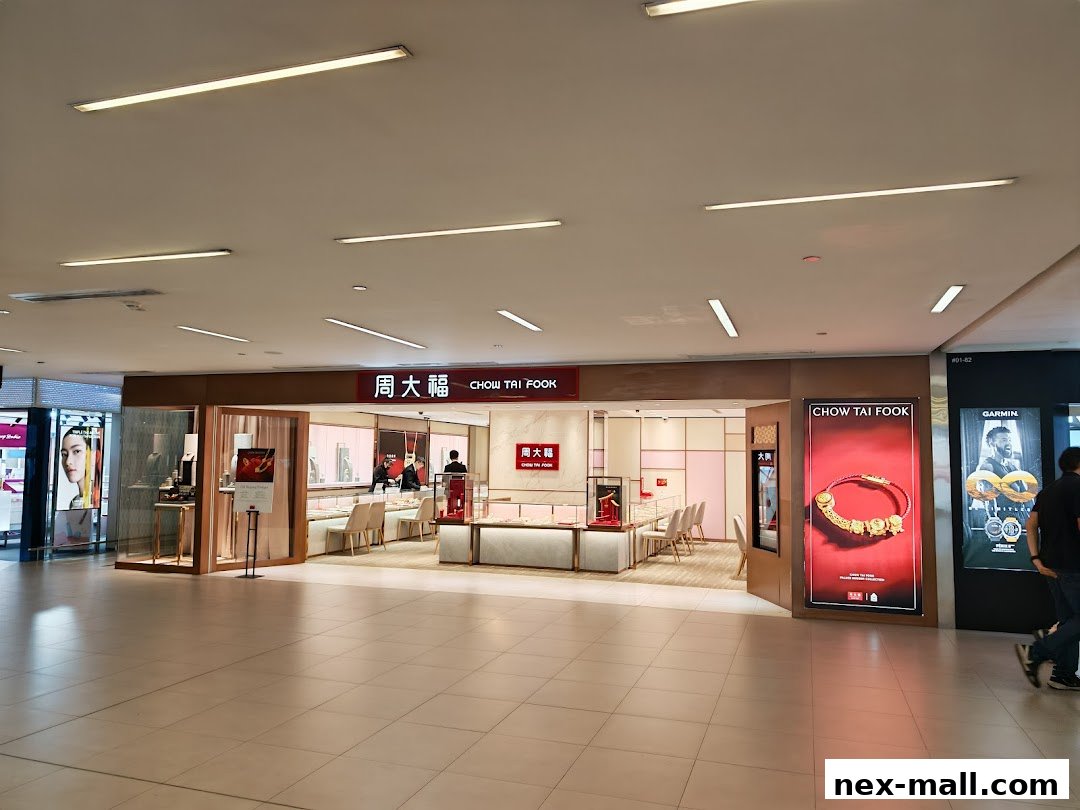 The Chow Tai Fook Jewellery store entrance with displays and a large advertisement.