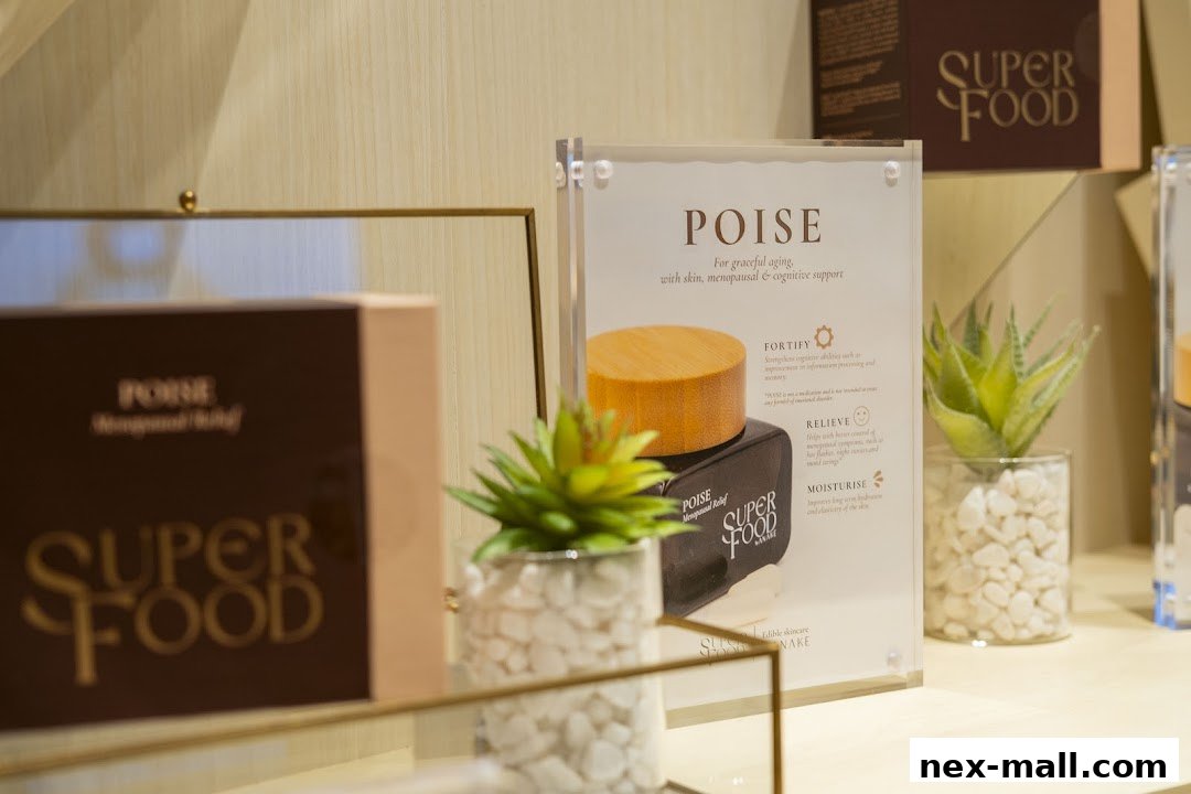 A display of 'POISE' Super Food products with informational signage and decorative plants.