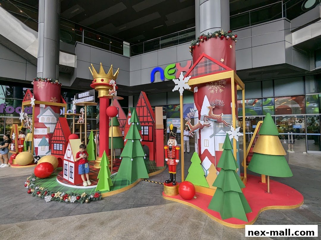 A festive Christmas display with a nutcracker, reindeer, and trees outside a shopping mall.
