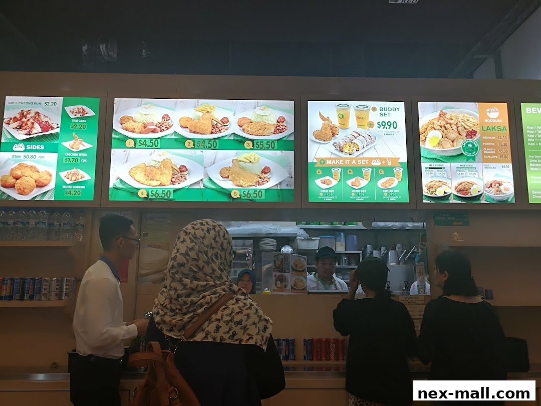 A brightly lit menu board displays various food items and sets from the Qi Ji restaurant.