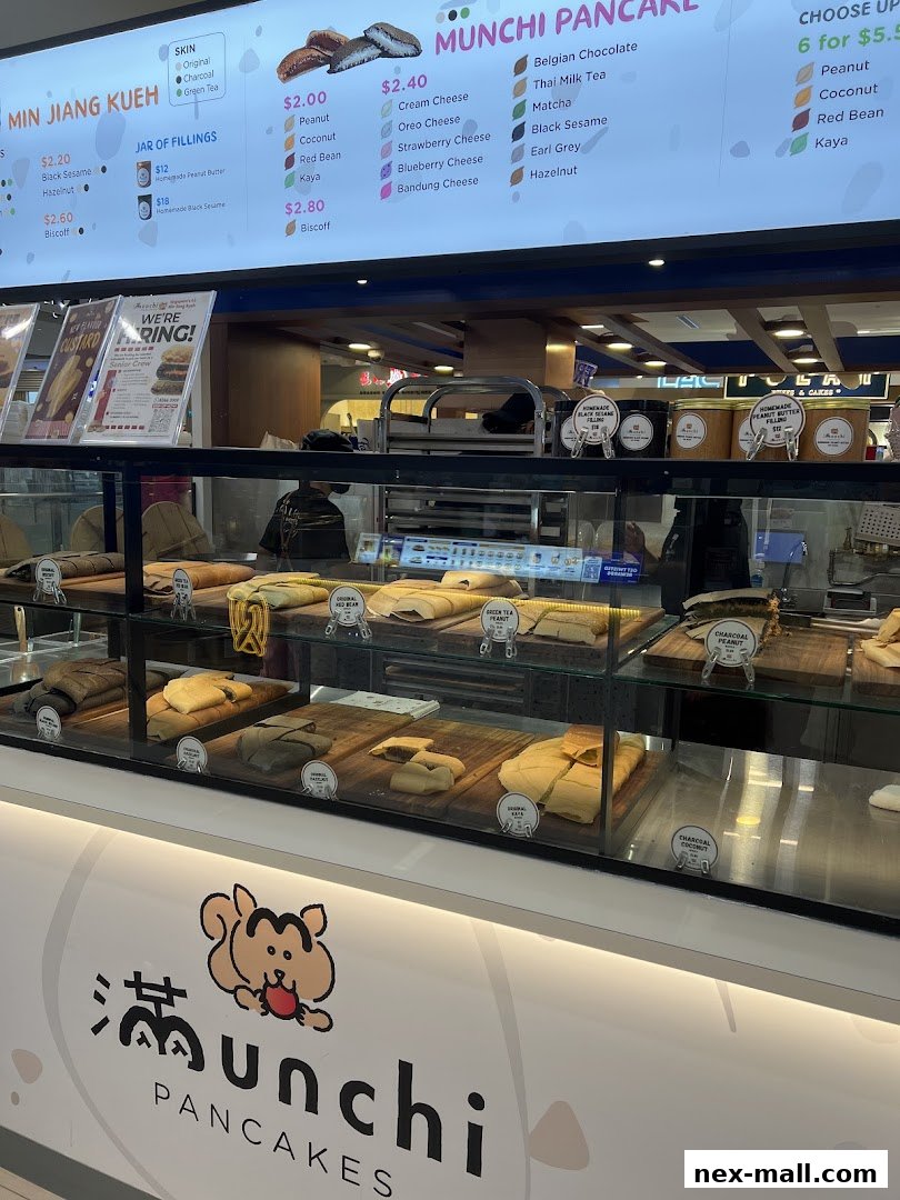 A display of Munchi Pancakes with a menu board showing various flavors and prices.