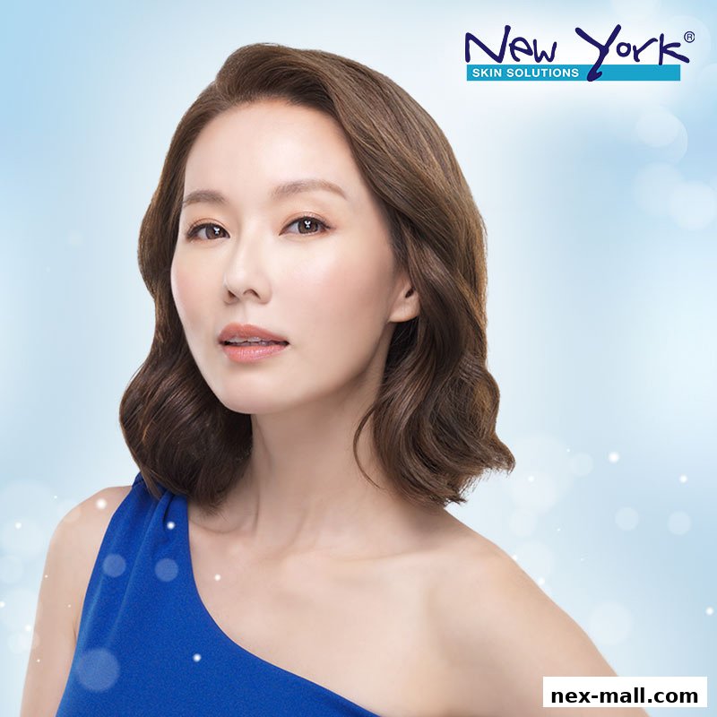 A woman with clear, radiant skin is featured in a promotional image for New York Skin Solutions.