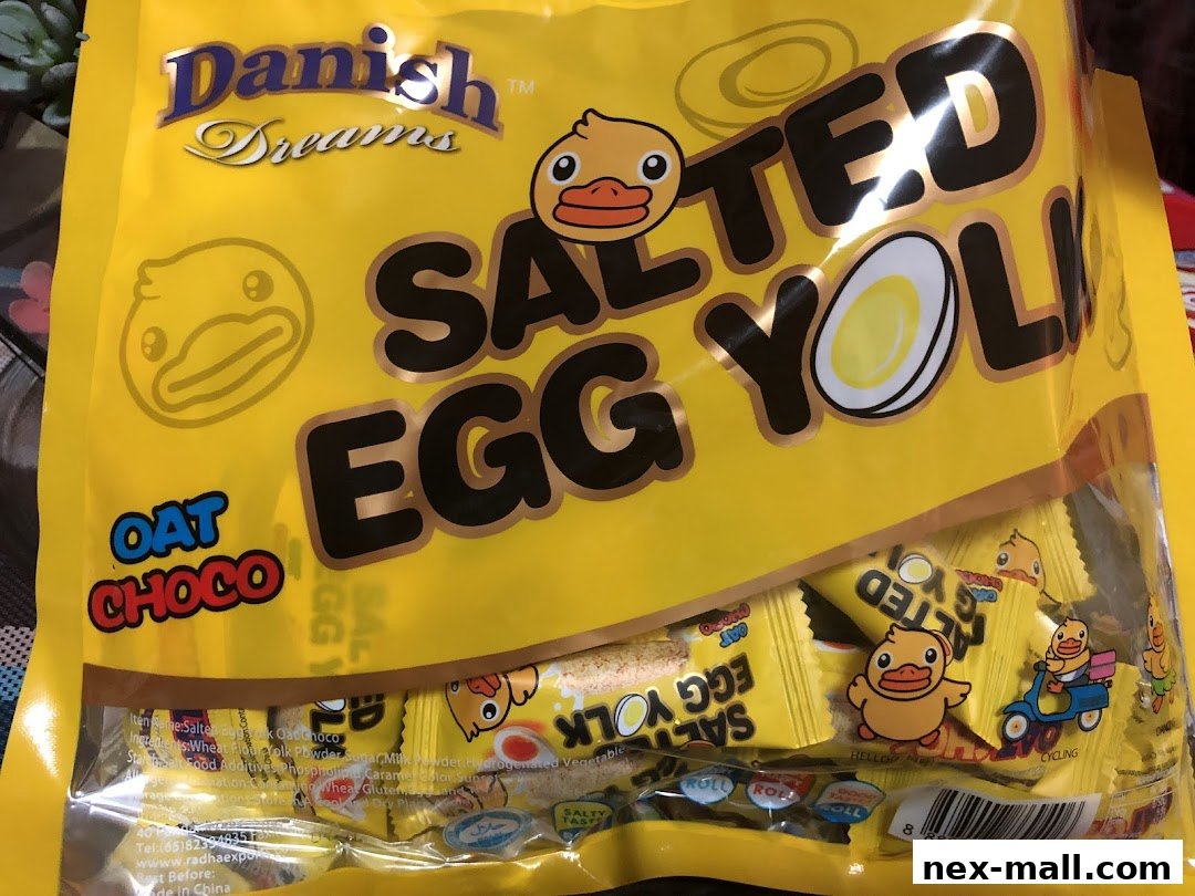 A bag of Danish Dreams Salted Egg Yolk Oat Choco snacks with cute duck illustrations.