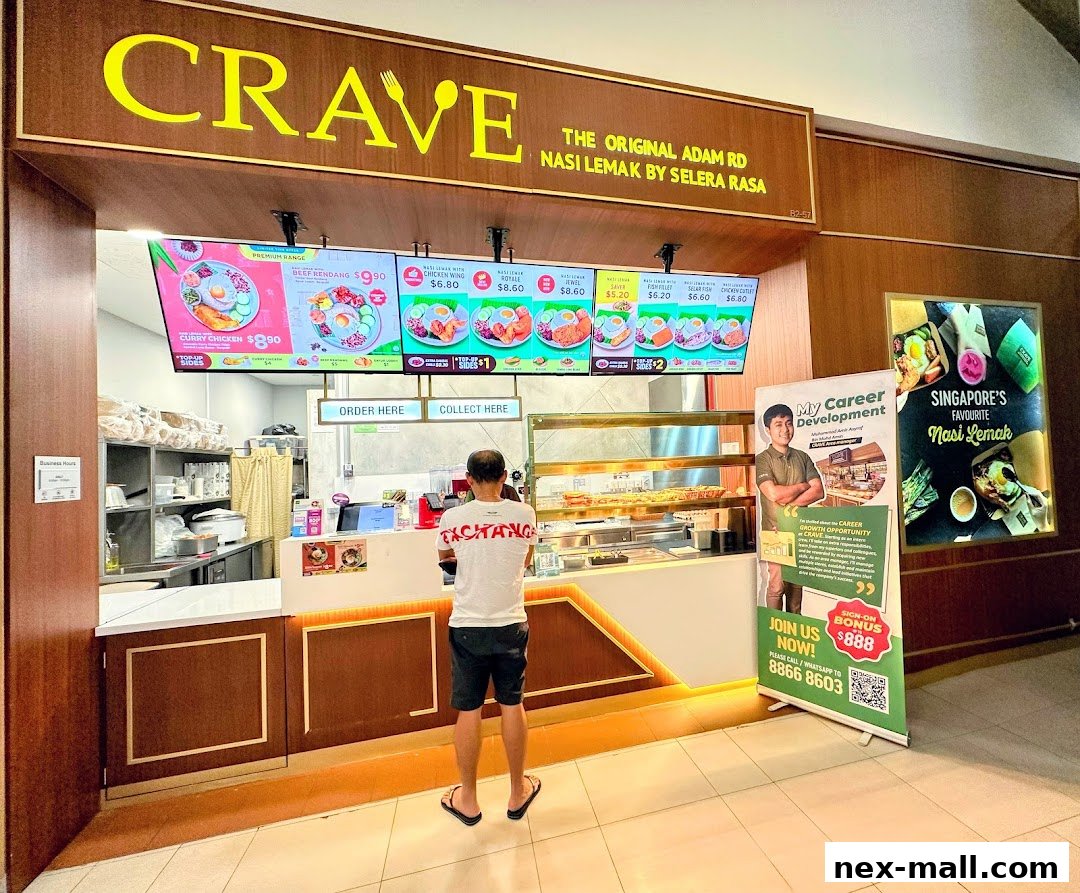 A Crave Nasi Lemak shop with digital menus displaying food items and prices.