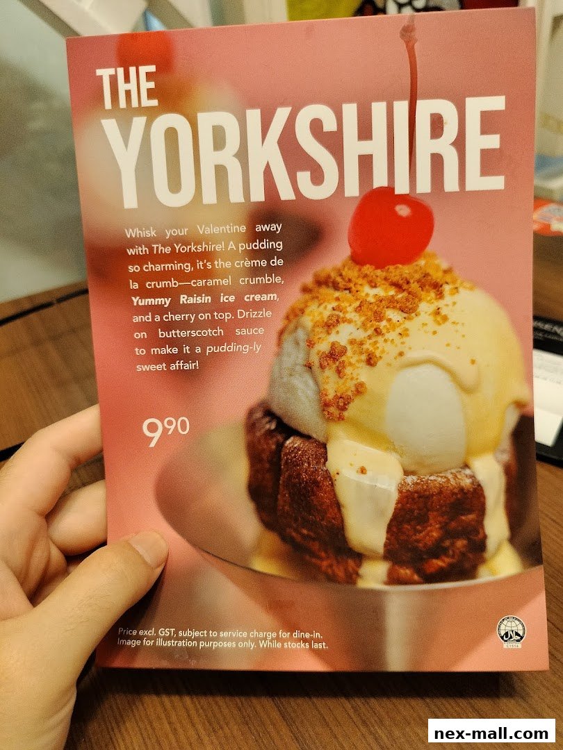 A menu item called 'The Yorkshire' featuring ice cream, pudding, and sauce.