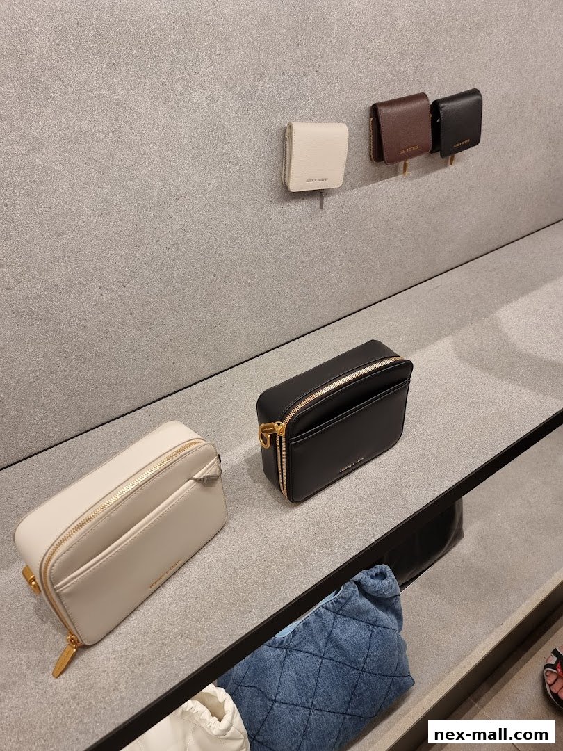 Stylish wallets and bags displayed on shelves in a retail store.