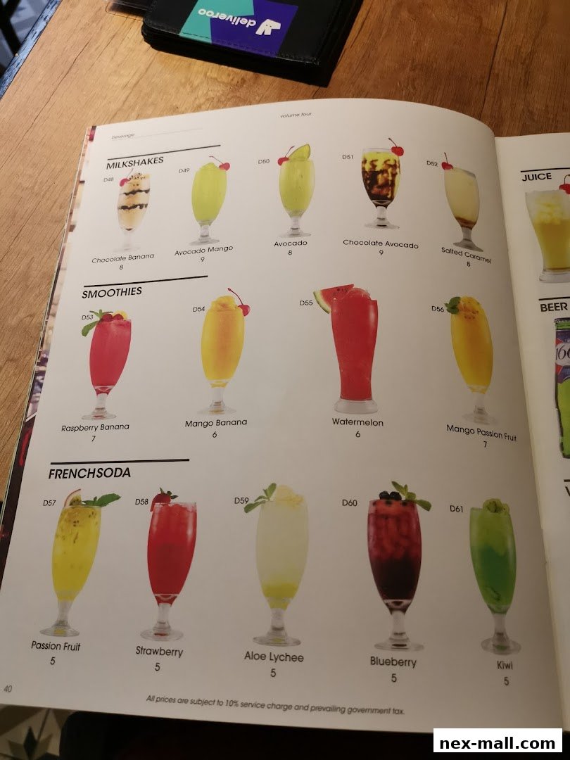 A menu page showcasing various milkshakes, smoothies, and French sodas with appealing visuals.