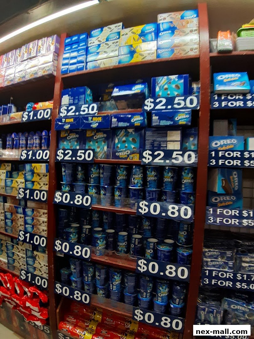 Shelves stocked with various Oreo cookie products and other snacks, with price tags displayed.