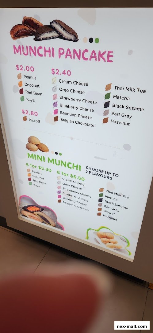 A menu board displaying various flavors of Munchi Pancakes and Mini Munchi.