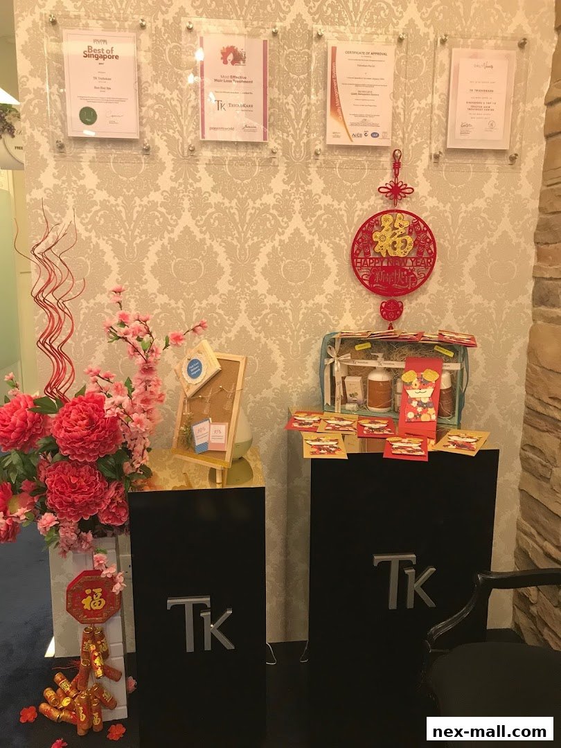 Interior shot of TK TrichoKare with awards, festive decorations, and product displays.