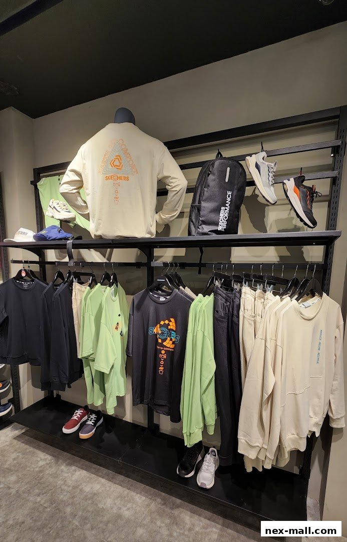 A Skechers store display featuring apparel, shoes, and a backpack on shelves and racks.