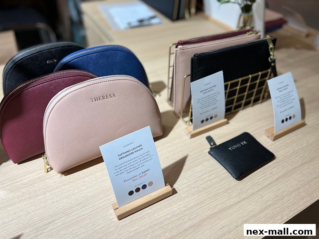 A display of personalized leather pouches and coin purses in various colors.