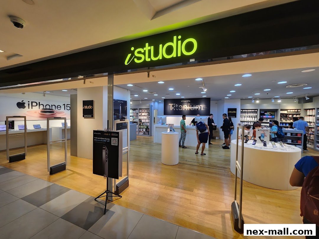 The entrance to an iStudio store showcasing Apple products and promotions.