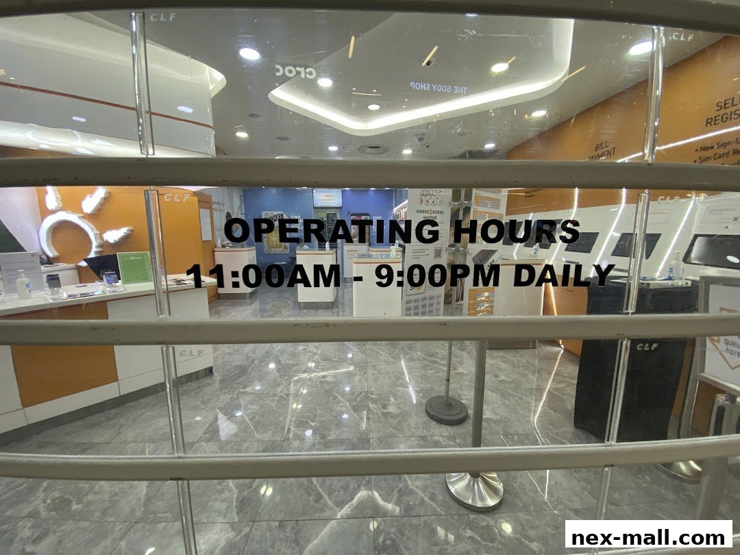 View of a phone shop's interior through a closed shutter, showing operating hours.
