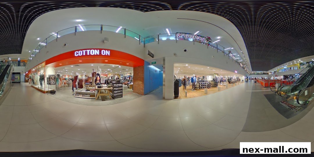 A wide view of the Cotton On store entrance and interior, showcasing clothing displays and mannequins.