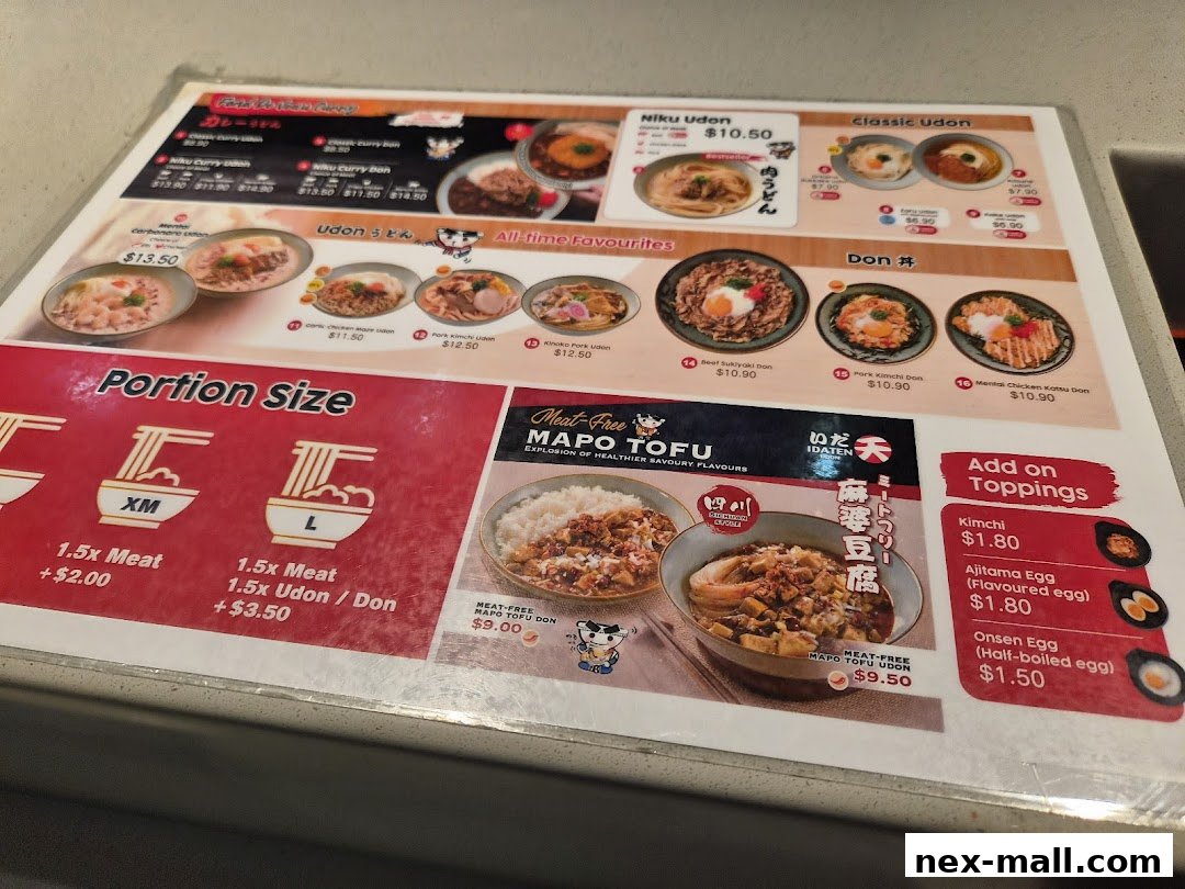 A menu from Idaten Udon featuring various udon and donburi dishes, portion sizes, and toppings.