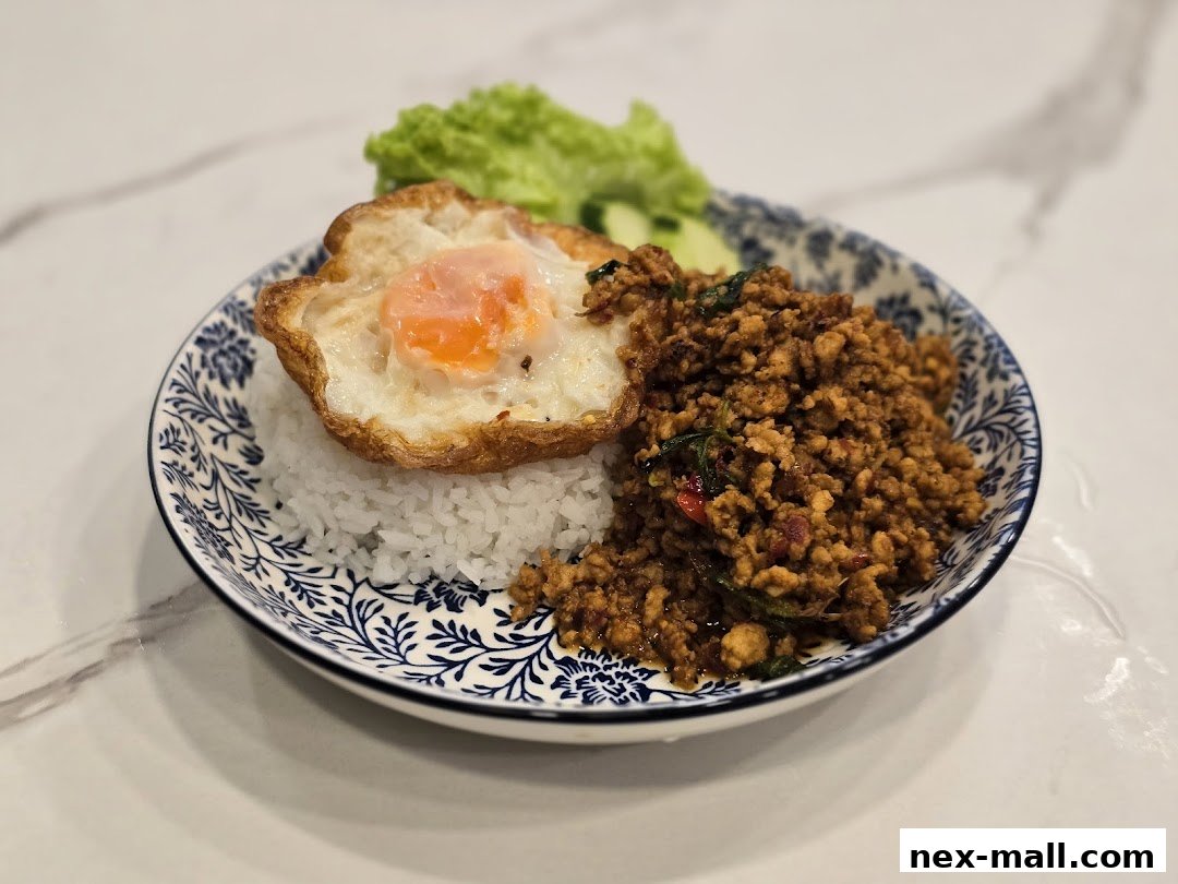 A delicious plate of minced meat with basil, served with rice and a fried egg.
