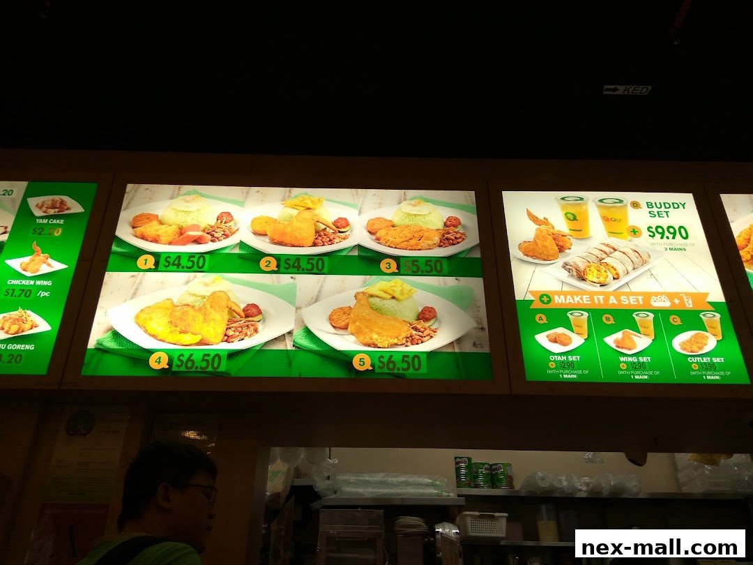 A brightly lit menu board displaying various meal sets and individual items from Qi Ji.