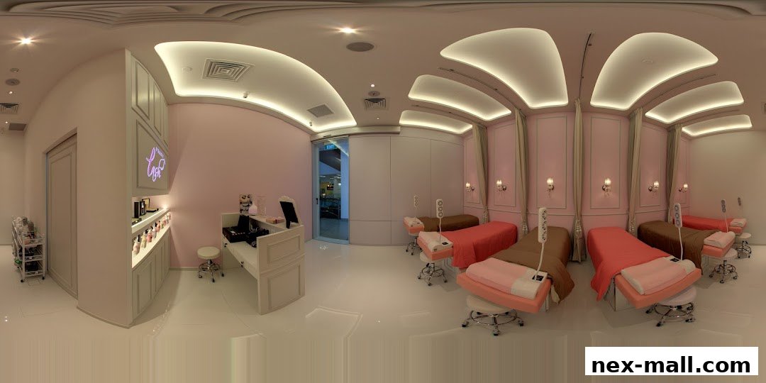 Interior of a clean and modern eyelash extension salon with multiple treatment beds.