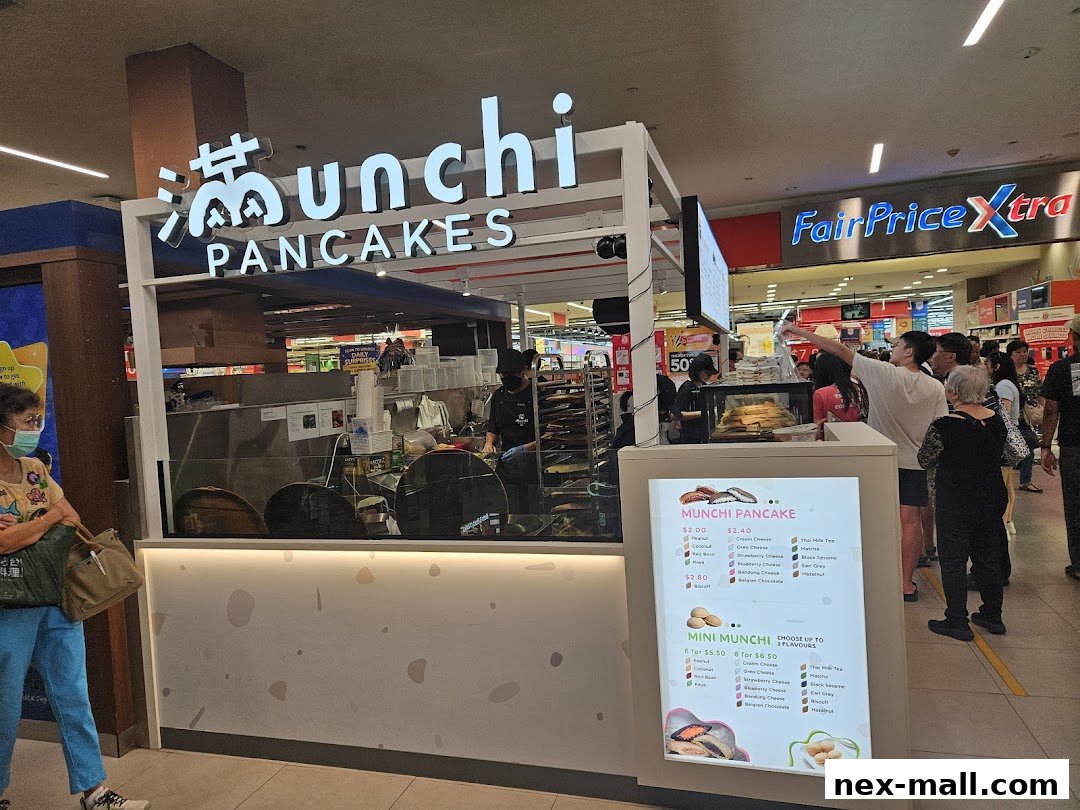 A bright pancake stall with a menu displayed, showing customers ordering.